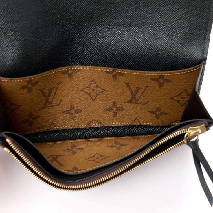 This is an authentic LOUIS VUITTON Reverse Monogram Emilie Wallet. This stylish wallet is crafted of Louis Vuitton reverse monogram coated canvas and features an envelope-style flap with a gold snap. This opens to a cross-grain leather and reverse monogram canvas interior with card slots, patch pockets, and a zipper compartment. Emilie Wallet, Monogram Canvas, Authentic Louis Vuitton, Patch Pocket, Card Slots, Slots, Grain, Envelope, Louis Vuitton