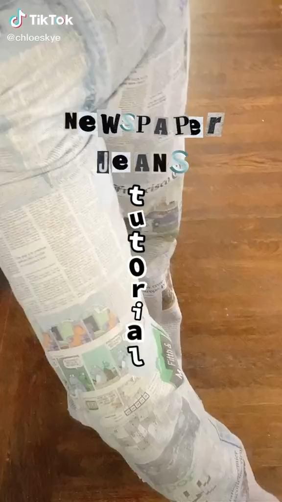 a person standing on top of a wooden floor next to a pile of paper towels