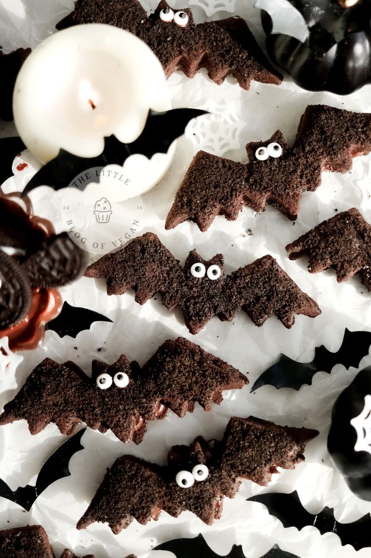 chocolate bats decorated with googly eyes and white candles