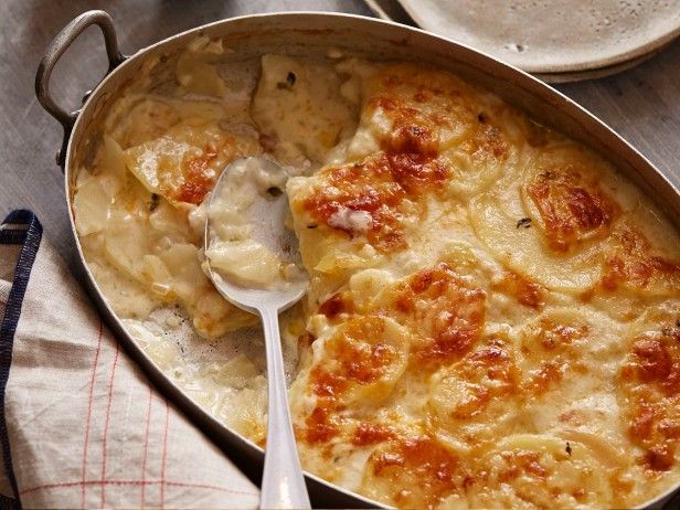 a casserole dish is shown with a spoon in it