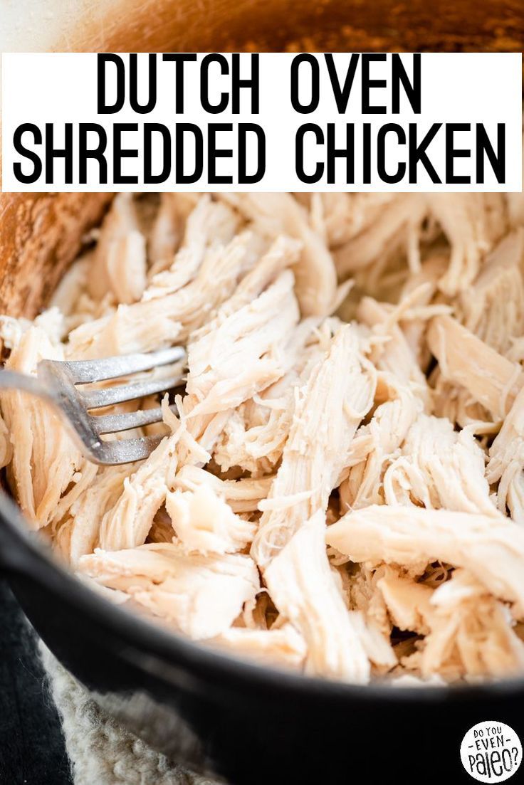 shredded chicken in a pot with a fork