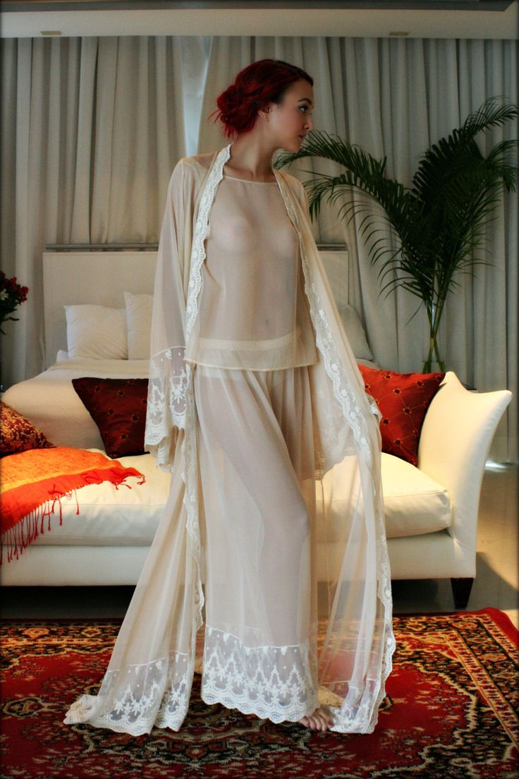 Sarafina Prima is our higher end line and this silk pajama set is from our latest collection. Silks, satin's and exclusive laces tailored for the clientele who is used to the best and perfectly suited for the elegant bride. The Ella silk pajama is an ultra soft Champagne silk chiffon that drenches the body in luxury. Simple loose fitting tank over our signature wide leg pant trimmed with embroidered Versailles French lace. Decadent elegance as seen through the eyes of Sarafina Prima. Let the mag Cream Lace-trim Sleepwear For Wedding, Cream Wedding Sleepwear With Lace Trim, Sheer Cream Sleepwear For Wedding Night, Sheer Sleepwear For Wedding Night, Cream Lace Sleepwear For Wedding Night, Sheer Lace Sleepwear For Wedding Night, Elegant Sheer Sleepwear For Wedding Night, Fitted Sheer Set For Wedding, Elegant Sheer Wedding Set