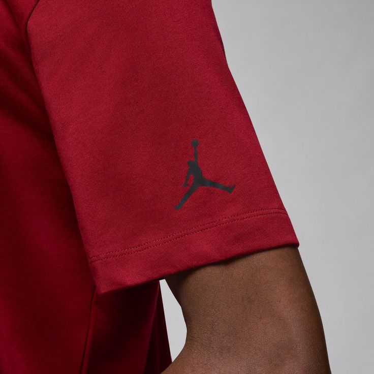 Representing your fave player to the whole crew is simple in the Jordan Watercolor Men's Tee. The Jumpman stands out well with its watercolor-like vibe, while the loose fit ensures you're comfortable as you show off your fandom. Jordan and Nike slipped in the minute detail of the small Jumpman to give it that something extra. Short-sleeved. Crew neck. Features Jordan Jumpman on front. Relaxed fit. Casual Moisture-wicking Tops For Fan Merchandise, Red Sporty Crew Neck T-shirt, Red Sporty Crew T-shirt, Red Crew Neck T-shirt With Graphic Print, Casual University Red Tops For Fans, Casual University Red Moisture-wicking Tops, Red Casual Crew Neck T-shirt, Red Crew Neck Casual T-shirt, Casual Red Crew Neck T-shirt