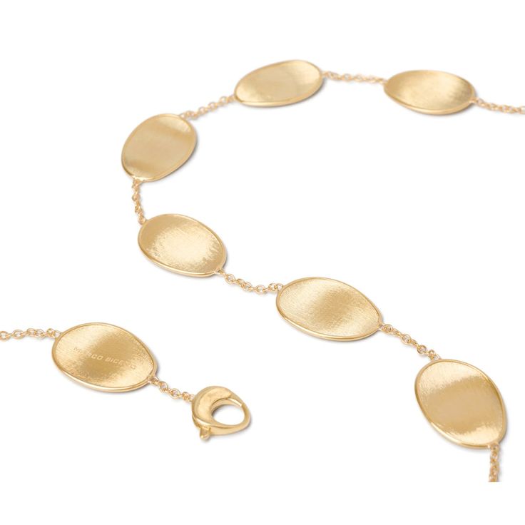 The Lunaria Collection is a line born from Marco's love of nature. Crafted entirely of hand-engraved, 18-karat yellow gold plates framed by polished gold and hand-molded by expert craftsmen, the collection resembles the gentle movement of petals blowing in the wind. The alternating sequences of plates yield lustrous necklaces, bracelets, earrings, and rings that translate into elegant and refined styles. MATERIAL: 18K Yellow Gold LENGTH: 18 inch Please Note: All our pieces are handmade and uniqu Fine Jewelry Yellow Gold Necklaces With Shiny Finish, Elegant Gold Oval Link Necklace, Refined Gold Jewelry With Elegant Design, Elegant Yellow Gold Necklace With Polished Finish, Formal Yellow Gold Necklace With Polished Finish, Elegant Engraved Gold Necklace, Oval Gold Necklace With Elegant Design, Elegant Gold Engraved Necklace, Gold Oval Necklace With Elegant Design