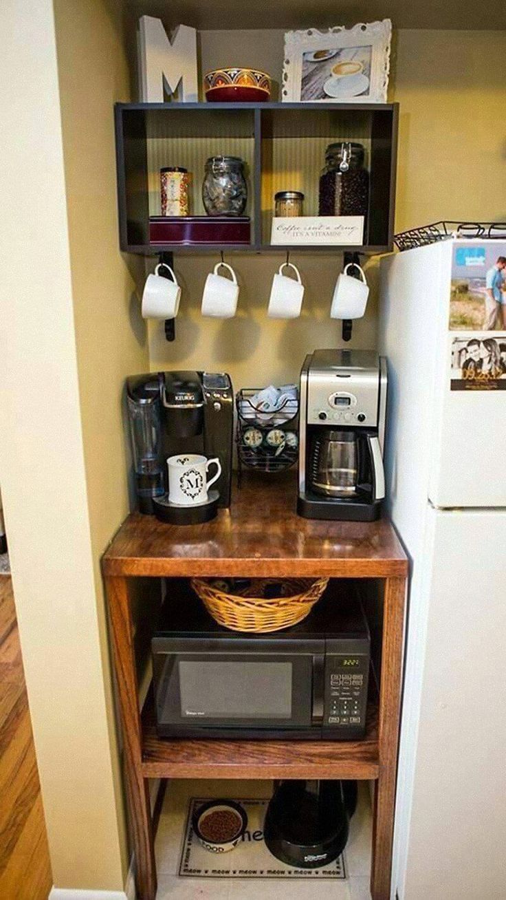 a small kitchen area with coffee maker and refrigerator