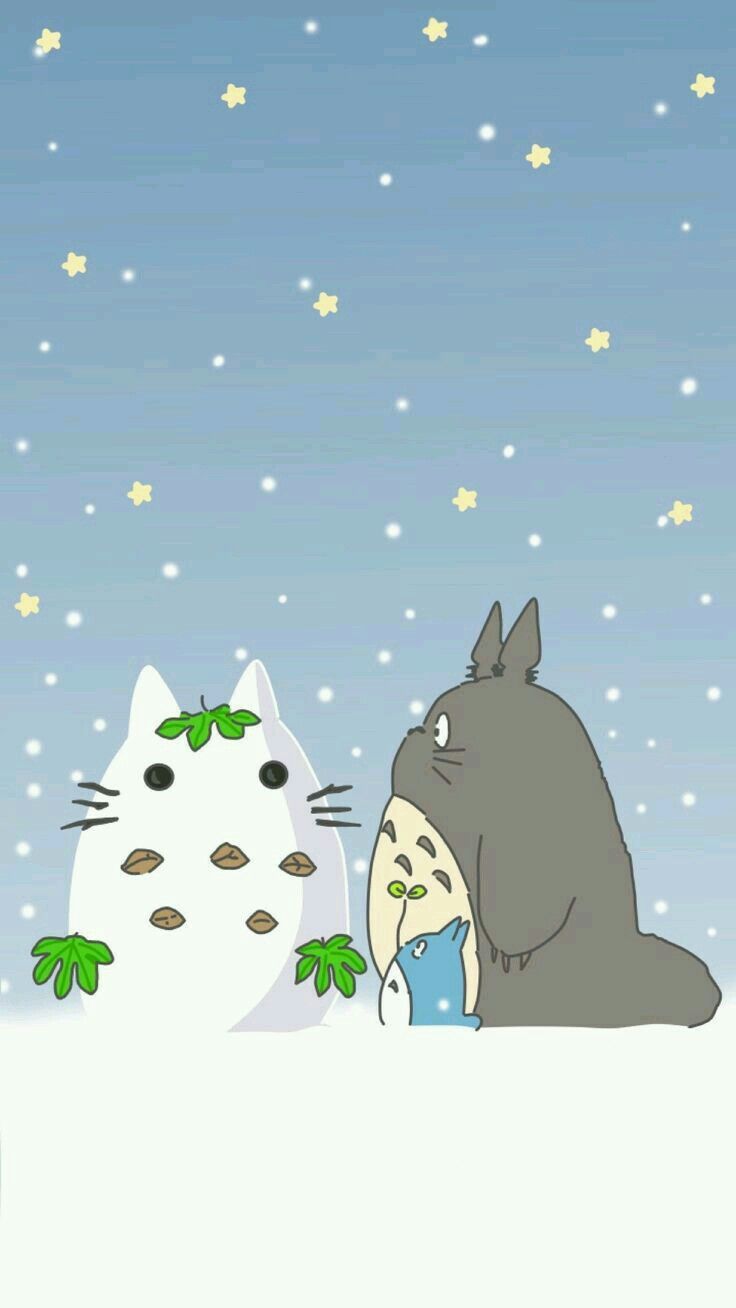 totoro and cat in the snow looking at each other