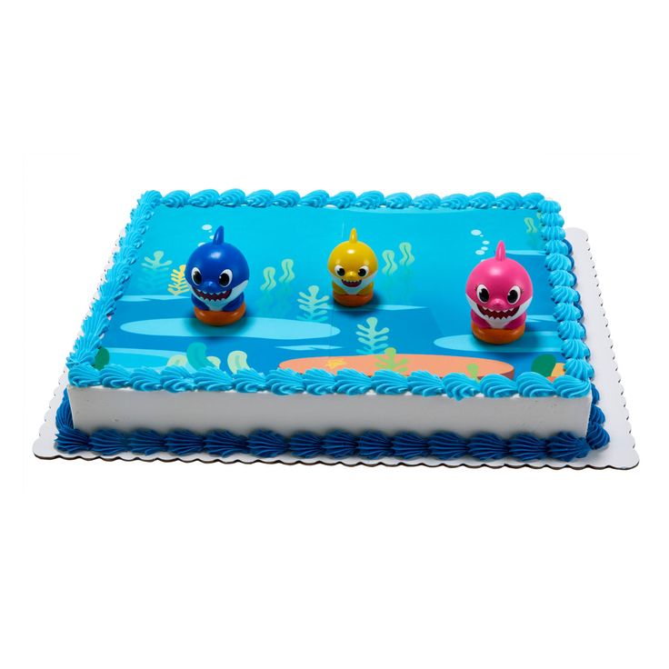 a birthday cake decorated with three little monsters