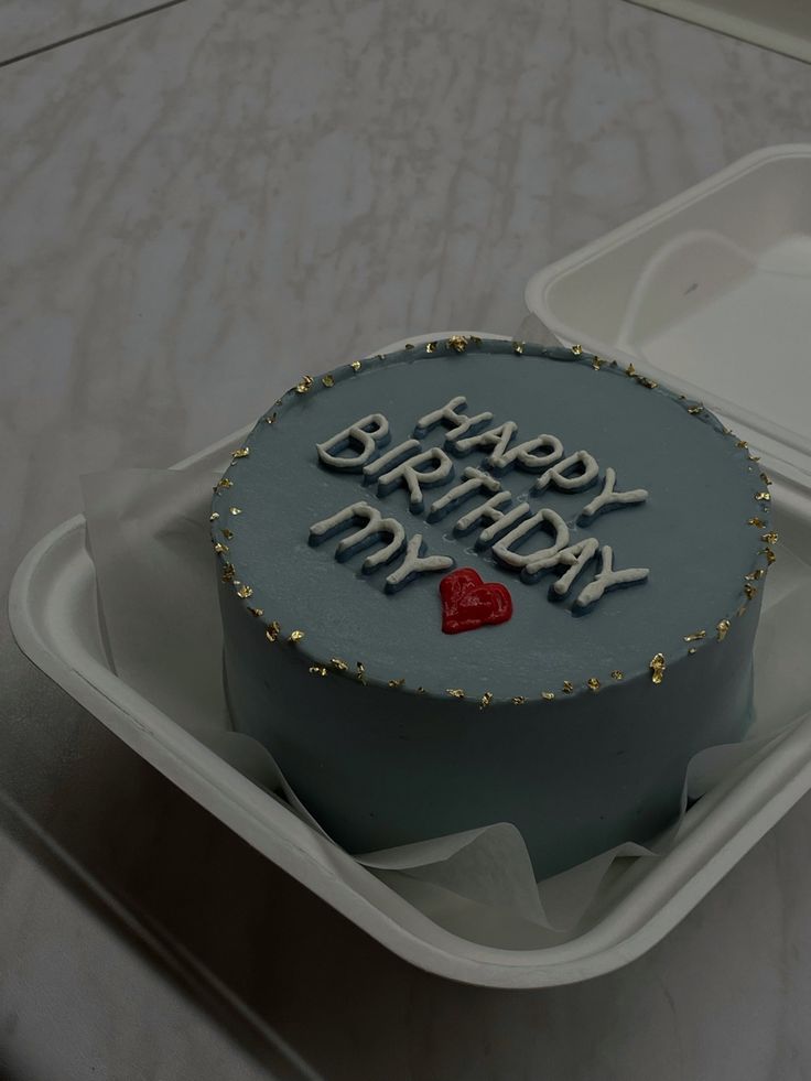 a birthday cake in a plastic container with the words happy birthday my heart on it