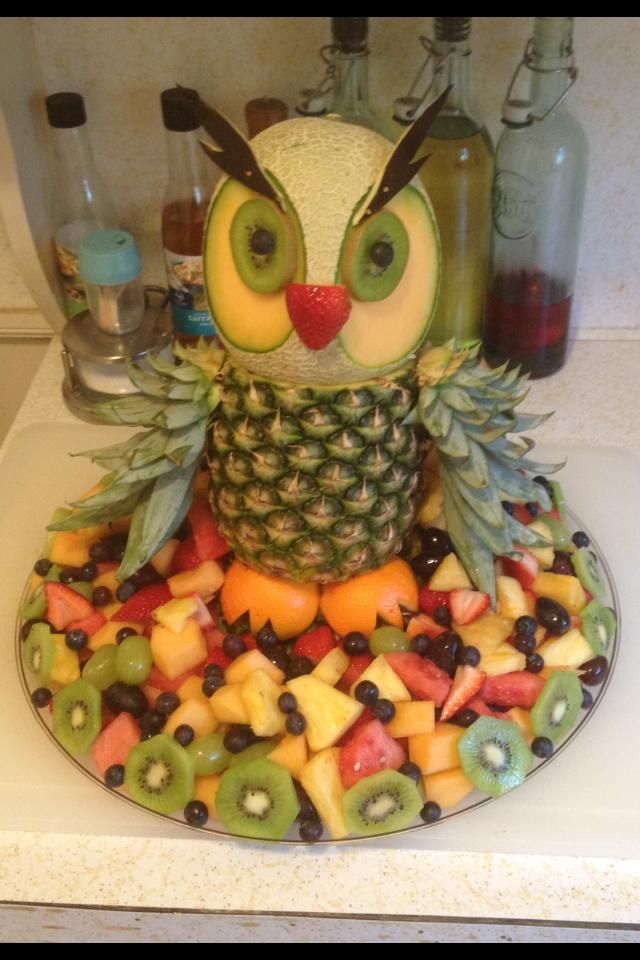 an owl made out of fruit on top of a counter