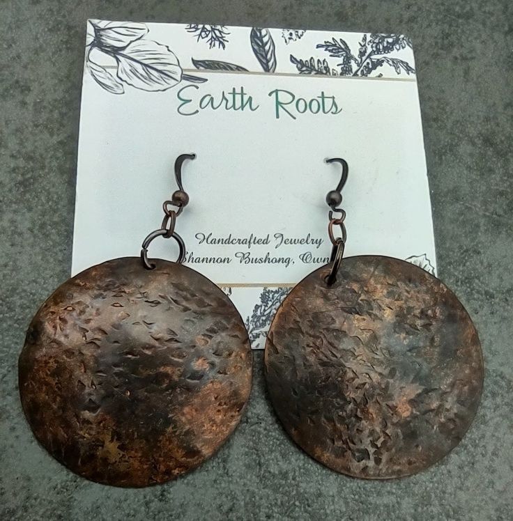 These earrings are designed with 1.5" copper discs that have been hammered for texture and design and then given a patina finish. They will ship in a gift box via USPS with tracking provided. Hand Forged Brown Earrings As A Gift, Brown Hammered Copper Earrings, Rustic Hammered Copper Earrings, Earthy Rust-colored Earrings As Gift, Earthy Rust-colored Earrings For Gift, Patina Finish, Copper Earrings, Handcrafted Jewelry, Jewelry Earrings Dangle