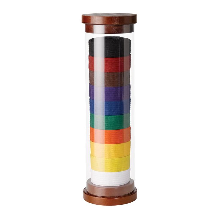 a multicolored vase sitting on top of a wooden stand