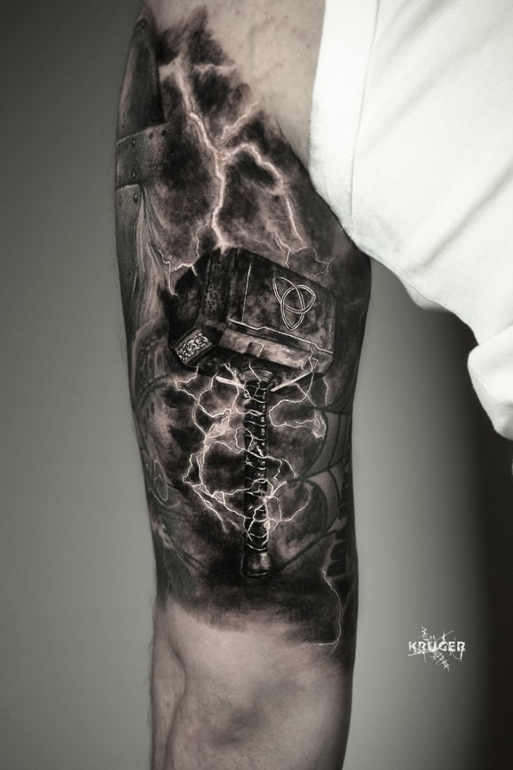 a black and white photo of a man's arm with lightning in the background