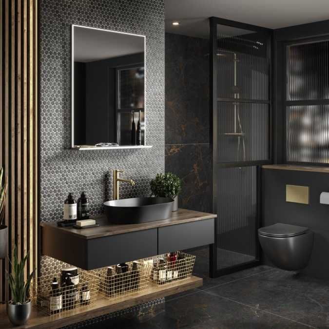 a bathroom with a toilet, sink and mirror in black and gold color scheme on the wall