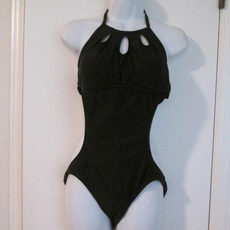 High Neckline With Cut-Out Detail Adjustable Neck Ties Ruched In Back At The Bottom Lined Lightly Padded Suit 80% Nylon 20% Spandex, Lining 100% Polyester Sz L Black T-back Bodysuit For Beach, Black T-back Bodysuit For The Beach, Black Stretch Backless Tankini, Black Fitted Halter Neck Swimwear, Fitted Solid Color Bodysuit With Cutout, Fitted Halter Neck Swimwear With Cutout, Black Stretch Cutout Swimwear, Fitted Halter Neck Bodysuit For Beachwear, Fitted Halter Neck Cutout Swimwear