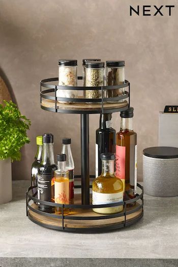 a shelf with bottles and spices on it