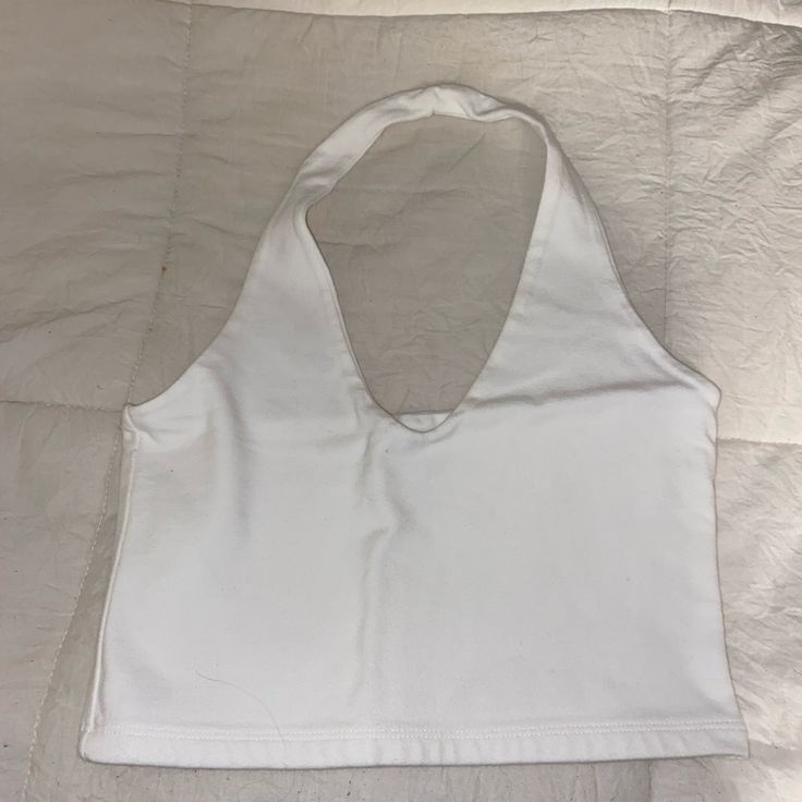 Brandy Melville White Halter Tank, Never Worn! White Halter Neck Top For Spring, Fitted White Halter Top For Spring, White Basic Tank Top For Day Out, Basic White Tank Top For Day Out, Basic White Tops For Day Out, White Cotton Halter Top Casual Style, Casual White Halter Neck Tank Top, Casual White Halter Top For Day Out, White Crop Top Tank For Day Out