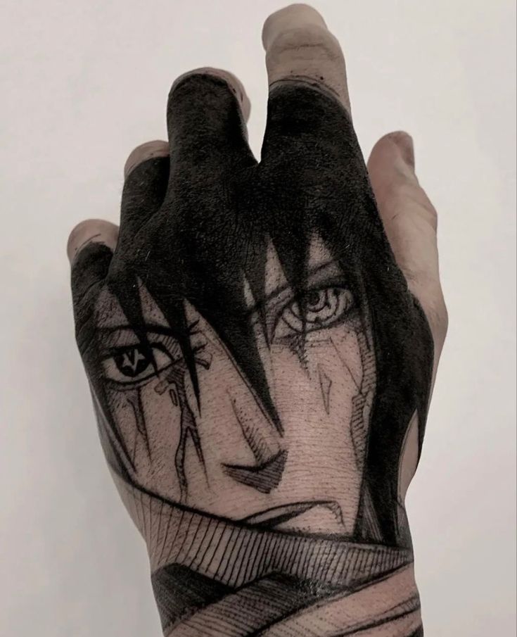 a person's hand with an artistic tattoo on it