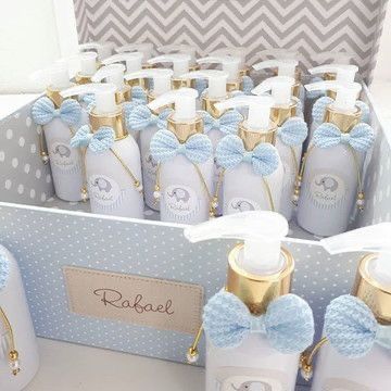 baby shower products are displayed in a blue and white box with gold trimmings