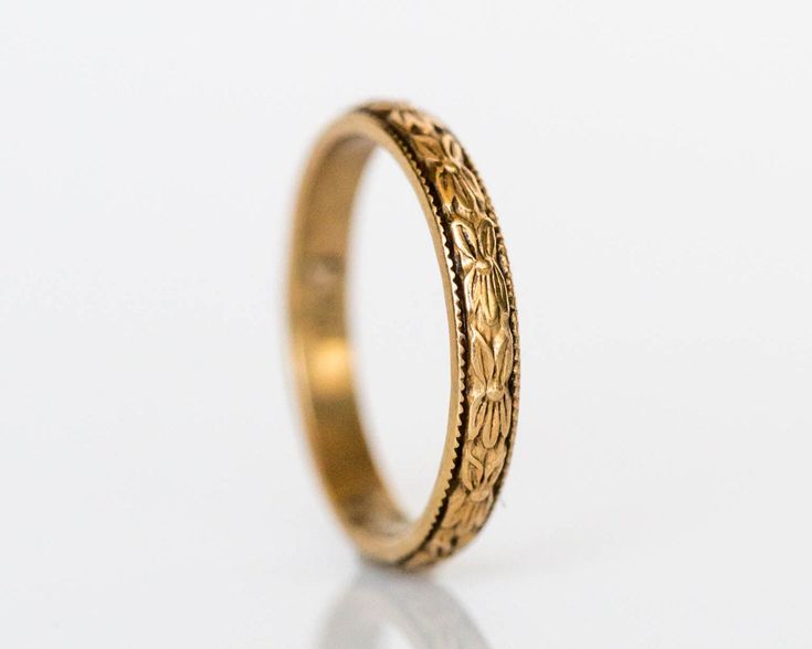 * VIEW A VIDEO OF THIS RING: https://youtu.be/397NvKpaGB4 * Description: Gorgeous antique baby ring circa 1920!. This ring is handcrafted in 14k yellow gold and is the perfect accessory for any baby. The band has a marvelous floral design running along the entire band. This is a true antique piece, and we are honored to offer it to our Etsy family. Item Details: Ring Size: .75 Metal Type: 14K Yellow Gold Weight: 0.6 grams Finger to top of Stone Measurement: 1.12mm Payment & Refund Details: * Vintage 14k Gold Stackable Jewelry, Heirloom Yellow Gold Stackable Rings, Heirloom 14k Gold Ring With Decorative Band, Heirloom Ring With Decorative Band In 14k Gold, Heirloom Rings With Decorative Band, Heirloom 14k Gold Stackable Rings, Victorian Gold Rings For Marriage, Heirloom Style 14k Gold Stackable Rings, Yellow Gold Brass Stackable Rings For Wedding