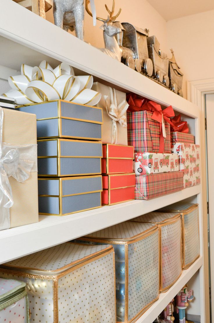 the shelves are filled with boxes and wrapped presents for christmas gifts on top of them