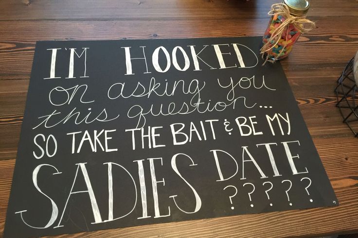 a sign that says i'm hooked on asking you to take the bat and be my sadies date?