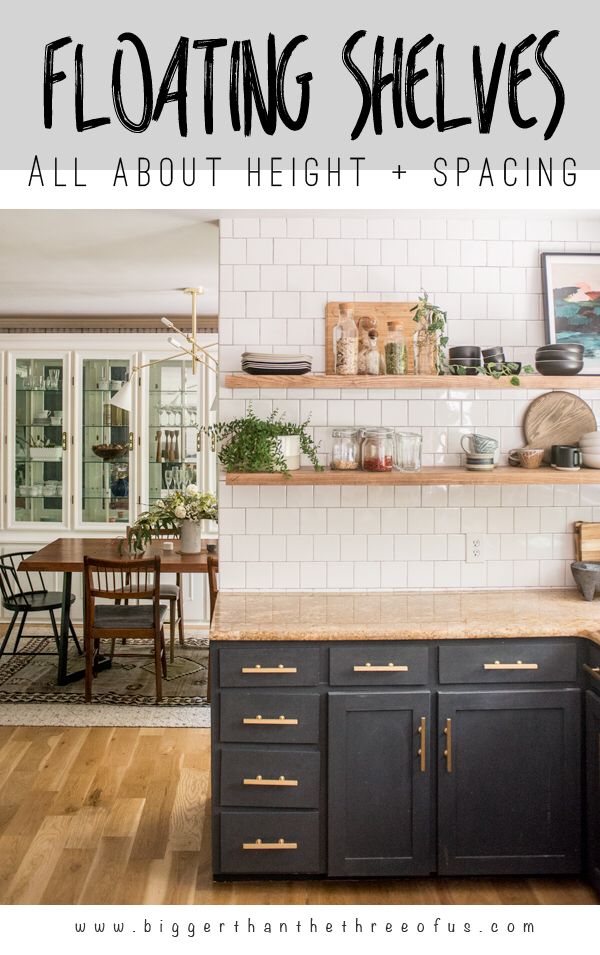 a kitchen with black cabinets and white brick walls, the words floating shelves all about height and space