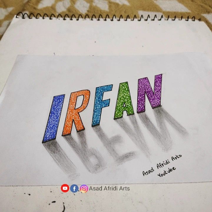 the word irfan is drawn in colored crayons on a piece of paper