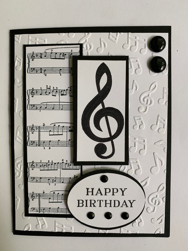 a happy birthday card with music notes and a musical note on the front, in black and white