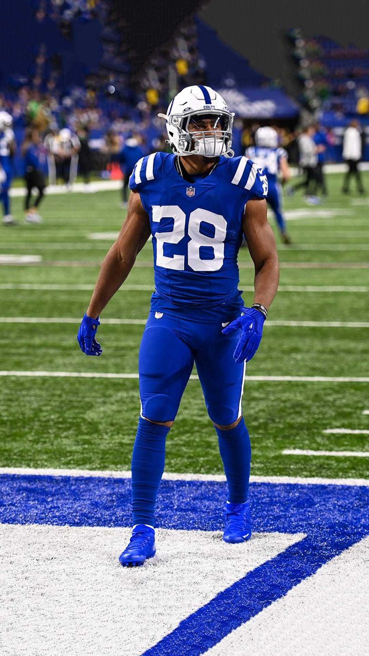 a football player is standing on the field