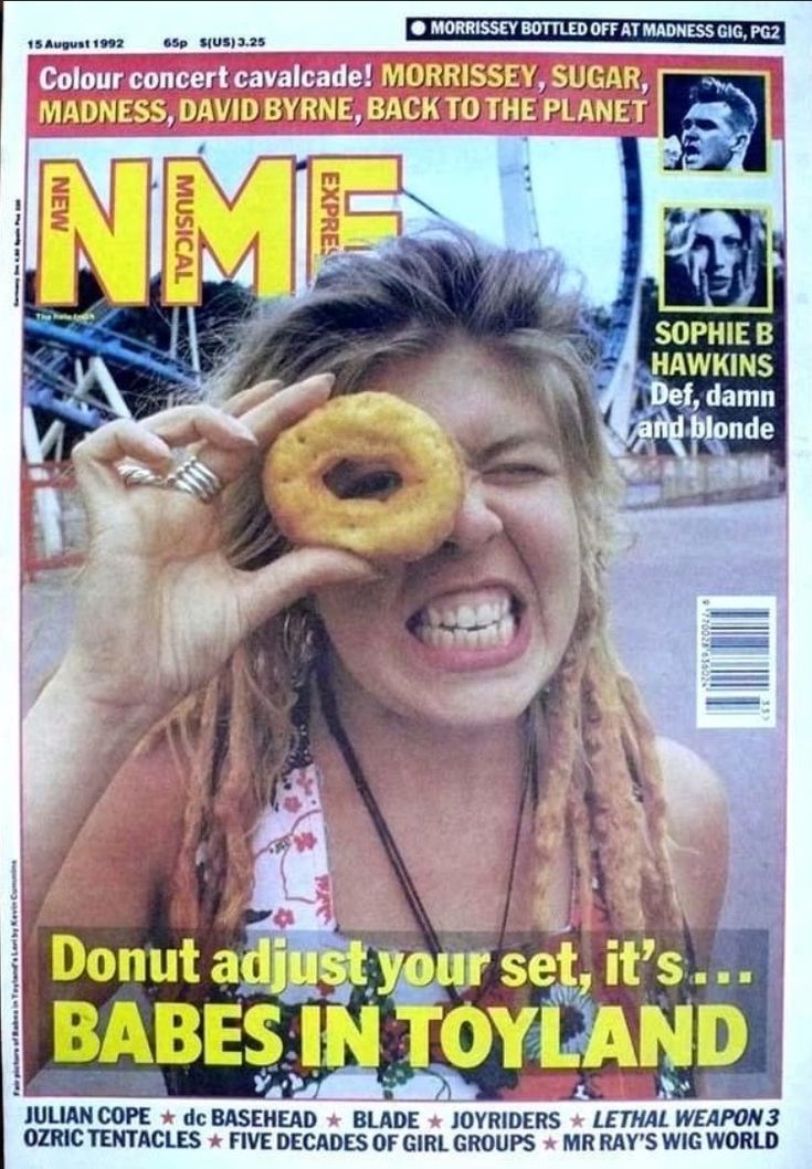 a magazine cover with a woman holding a doughnut in front of her face and smiling