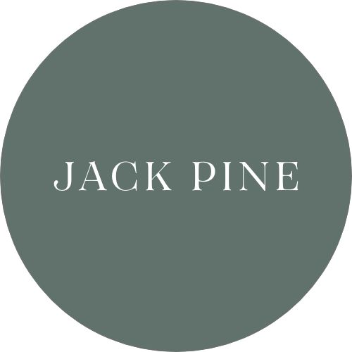 the word jackpine in white on a green circle with black and white lettering underneath it