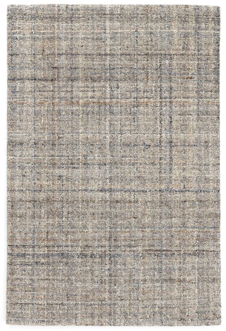 an area rug with grey and blue plaid pattern on the side, in front of a white background