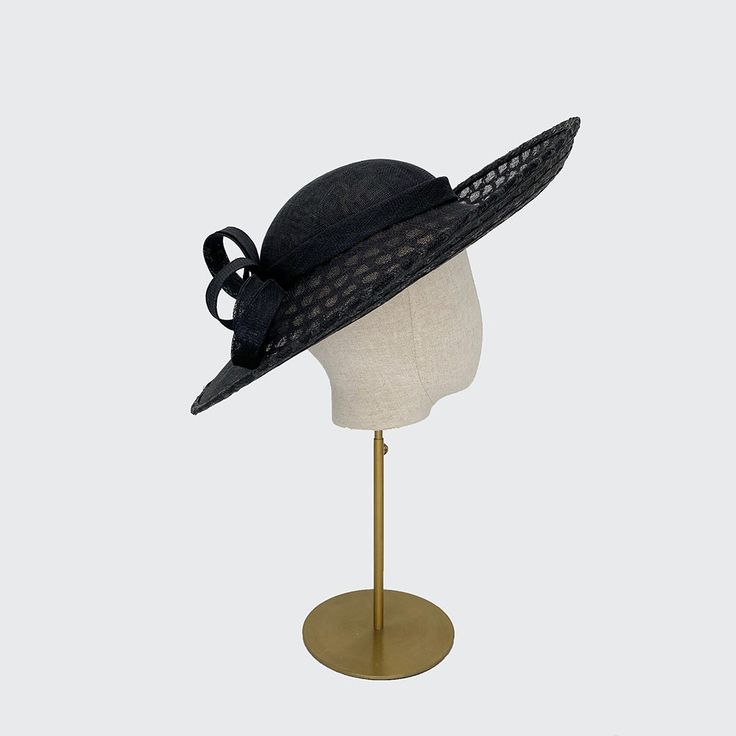 Black upsweep perching hat features a very shallow crown and can be worn to the side or straight. Fit with an elastic. Chic Adjustable Costume Hats With Short Brim, Elegant Summer Fedora With High Crown, Adjustable Short Brim Hat For Kentucky Derby, Classic Adjustable Costume Hats For Kentucky Derby, Chic Adjustable Brimmed Costume Hats And Headpieces, Classic Kentucky Derby Hat With Structured Crown, Chic Adjustable Brimmed Costume Hat, Elegant Fedora With Flat Brim, One Size Fits Most, Chic Adjustable Sun Hat With Structured Crown