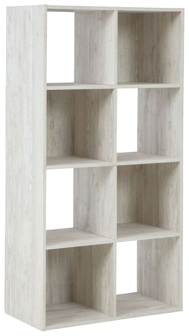 a white bookcase with four shelves on each side