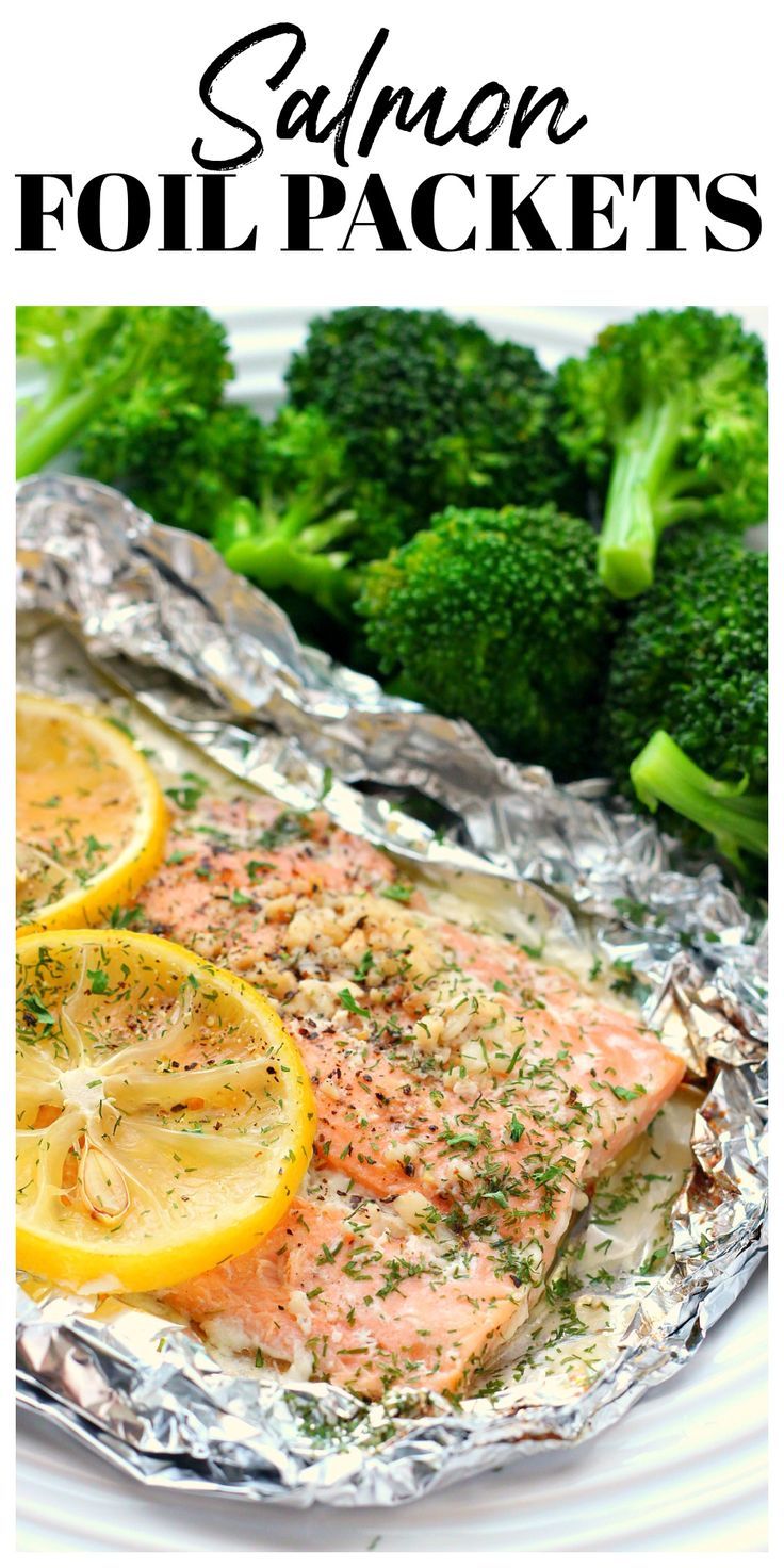 Salmon with lemon in juices sitting on foil. Salmon And Broccoli Foil Packets, Oven Baked Fish Recipes Foil Packets, Salmon Aluminum Foil Recipe, Baked Cod In Foil Packets, Tin Foil Salmon Oven, Salmon Foil Packets Oven With Broccoli, Baked Salmon Foil Packets, Foil Packets For The Oven Salmon, Oven Salmon Recipes Foil Packets