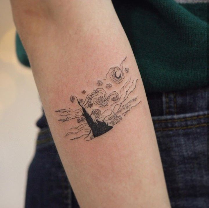 a person with a small tattoo on their arm