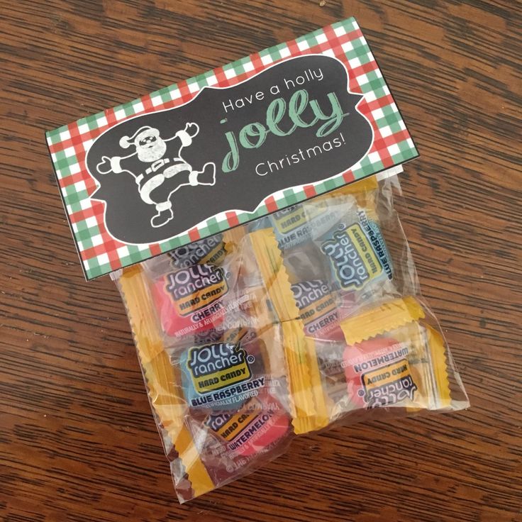 candy wrapped in cellophane on top of a wooden table