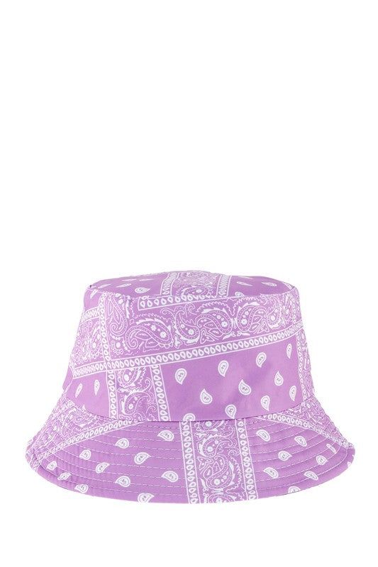 Bandana Print Bucket Hat This hat features a trendy bandana print, adding a touch of style to any outfit. Protect yourself from the sun while looking fashionable with this versatile bucket hat. Made In: China Bohemian Bandana For Beach In Summer, Adjustable Cotton Bandana For Summer, Trendy White Bucket Hat, Trendy Festival Bucket Hat, Trendy Short Brim Bucket Hat For Festivals, Bohemian Bandana For Spring Vacation, Trendy Festival Bucket Hat With Short Brim, Summer Beach Cotton Bandana, Cotton Bandana For Beach In Summer