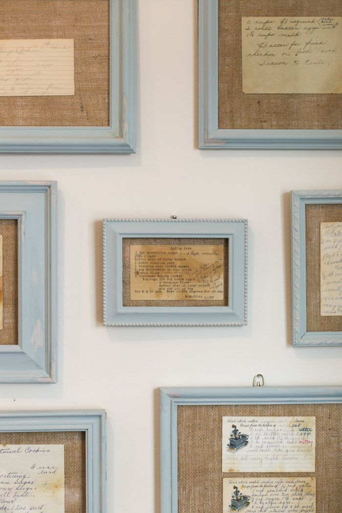 several framed pictures with writing on them hanging on the wall next to each other in blue frames