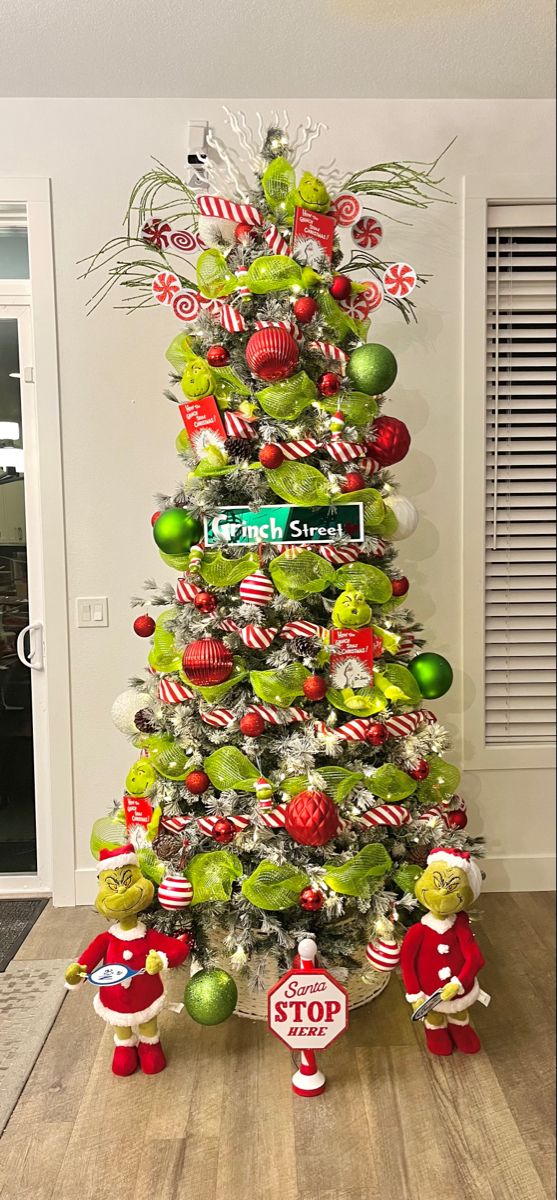 a christmas tree decorated with green and red ornaments