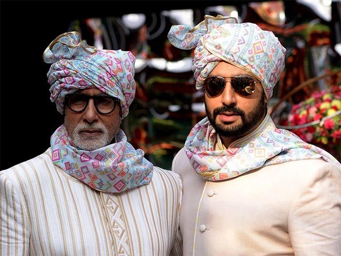 two men wearing turbans and sunglasses standing next to each other