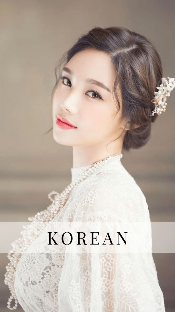 a woman wearing a white dress and holding a flower in her hair with the words korean on it