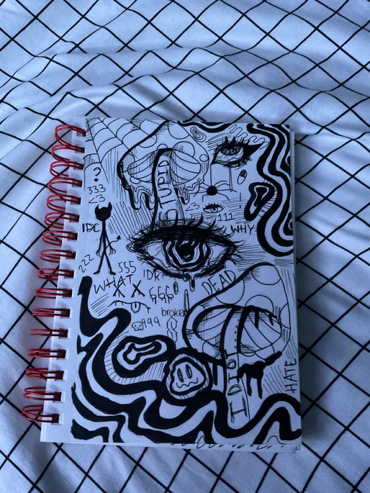 a notebook with an eye drawn on it