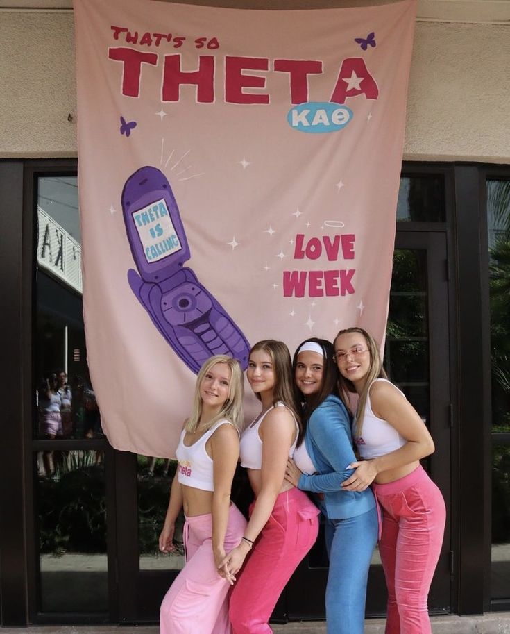 three girls posing in front of a giant cell phone sign with the words, that's so tho kao love week