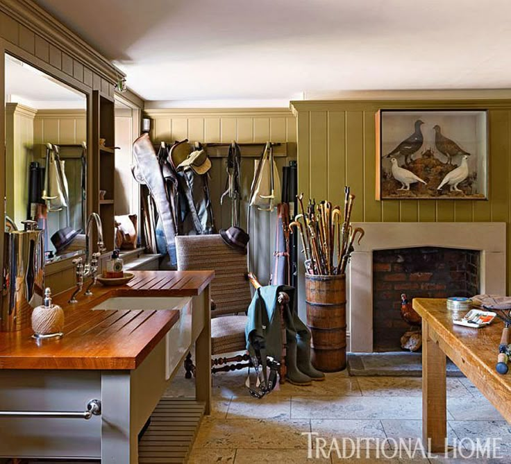 a living room filled with lots of furniture next to a fire place