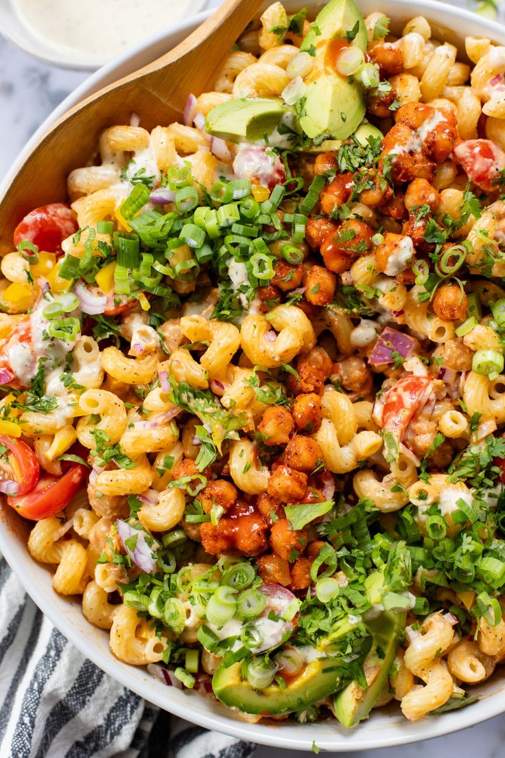 a bowl filled with macaroni salad and dressing