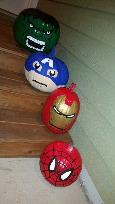 the avengers and spiderman balls are lined up on the steps in front of the house