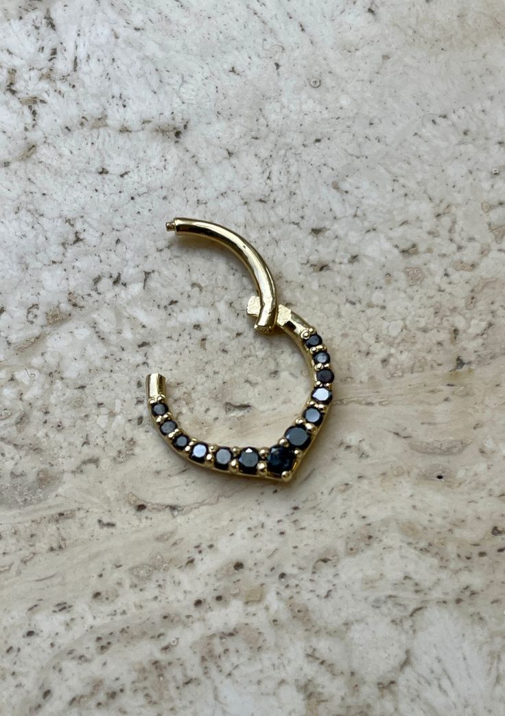 Chevron Hinged Hoop For Nose Ear Daith and More  * Made of 14K yellow gold * Features 1.3up 2mm black natural diamond prong setting  approx. 0.20 carat of diamonds  * Diamond Clarity -VS-SI  * Diamond Color - Black  * Great for septum and Cartilage available in 14 ,16 and 18 gauge  More Natural Gemstones available: Ruby, Emerald , Sapphire ,Topaz Opal and Black diamonds  Made in USA 🇺🇸  We are a U.S. based seller  All of our products are shipped from within the United States. 14k White Gold Jewelry With Black Diamonds, Fine Jewelry With Black Diamonds In Gold, Fine Jewelry Gold Jewelry With Black Diamonds, Fine Jewelry Gold With Black Diamonds, Fine Jewelry In Gold With Black Diamonds, Yellow Gold Jewelry With Black Diamonds, Fine Jewelry With Diamond Accents And Black Spinel, Fine Jewelry With Black Spinel And Diamond Accents, Minimalist Jewelry With Black Diamonds And Black Spinel