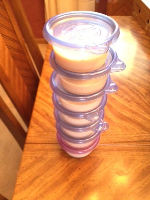 a stack of cups sitting on top of a wooden table