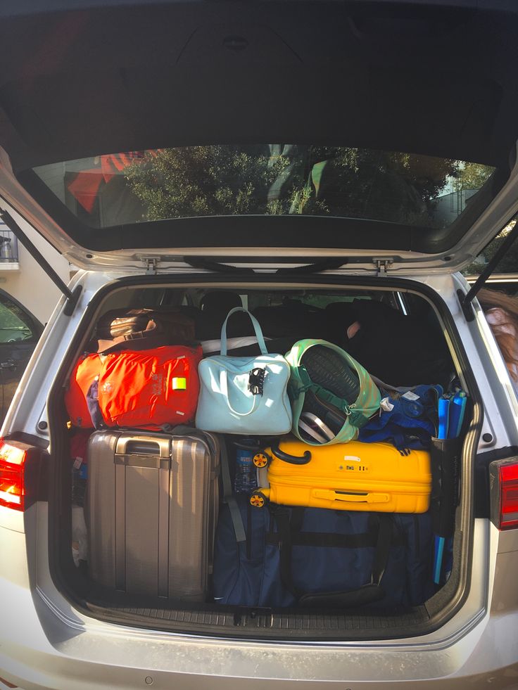 the back end of a car filled with luggage